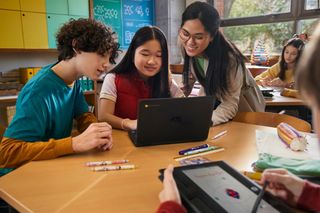 Students and a teacher using the HP Fortis G1i Flip Notebook PC.